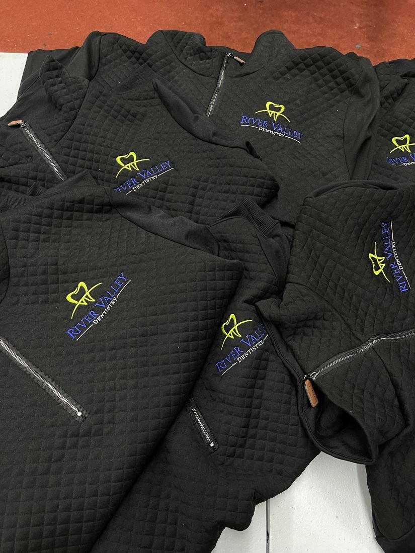 Quilted jackets with embroidered logos