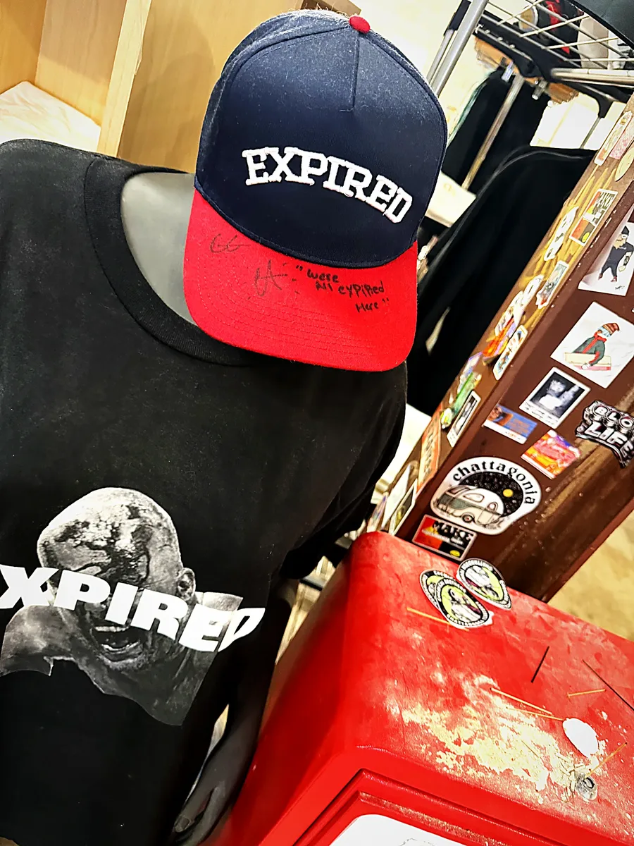 Hat-and-tee display on the Humanitees shop floor